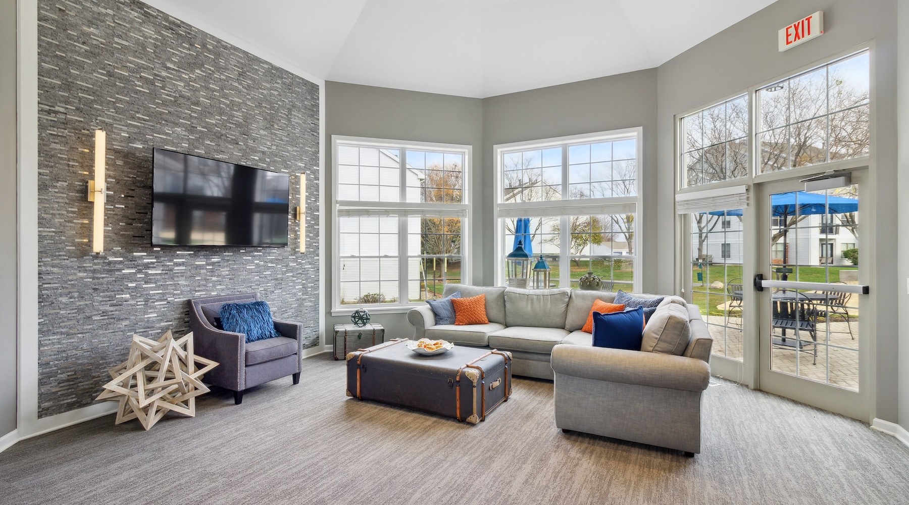 a clubroom with a couch and a tv