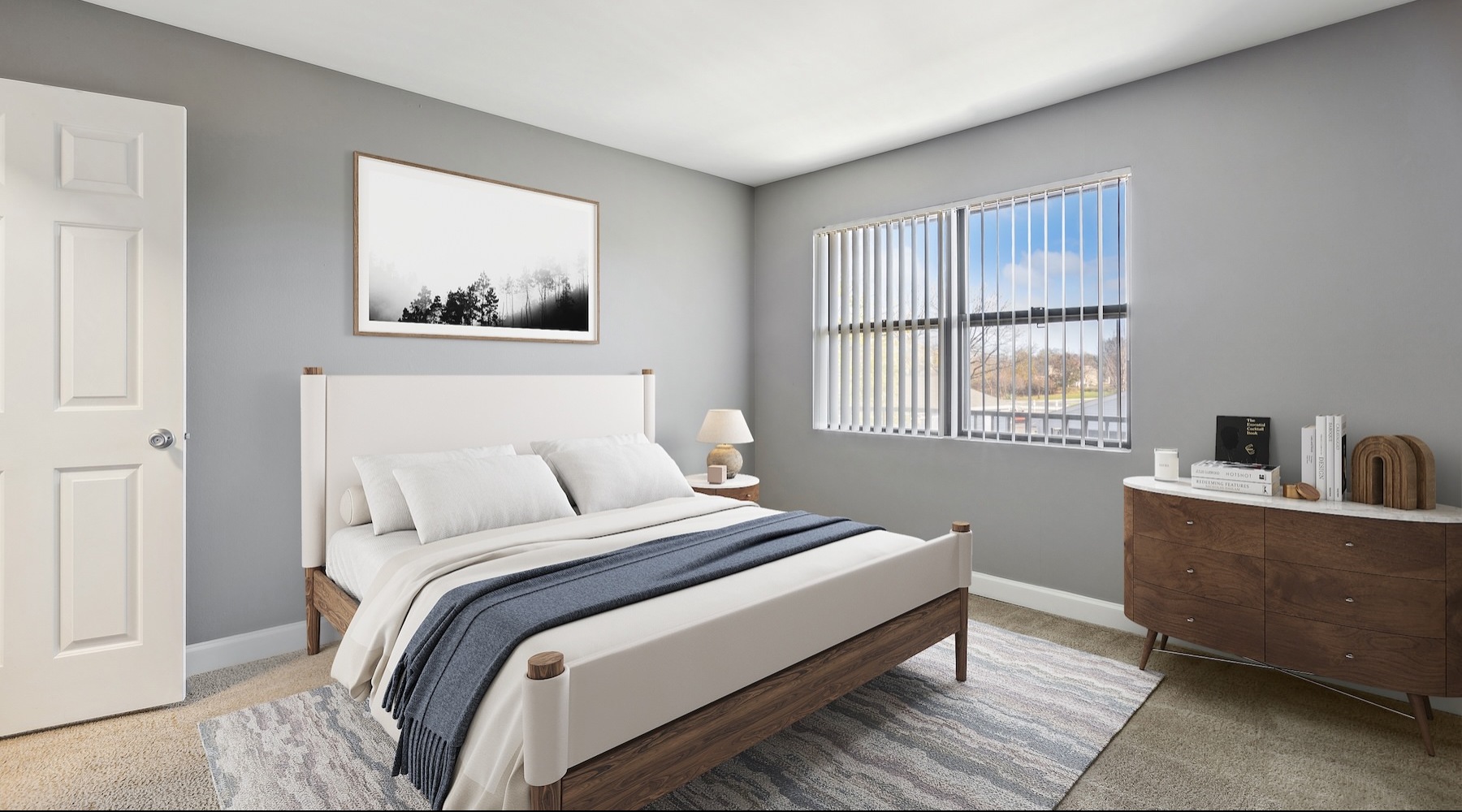 a bedroom with a bed and a dresser