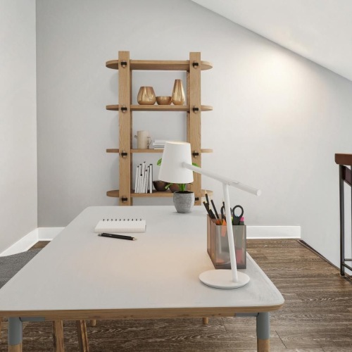 a desk and a chair at the top of a staircase